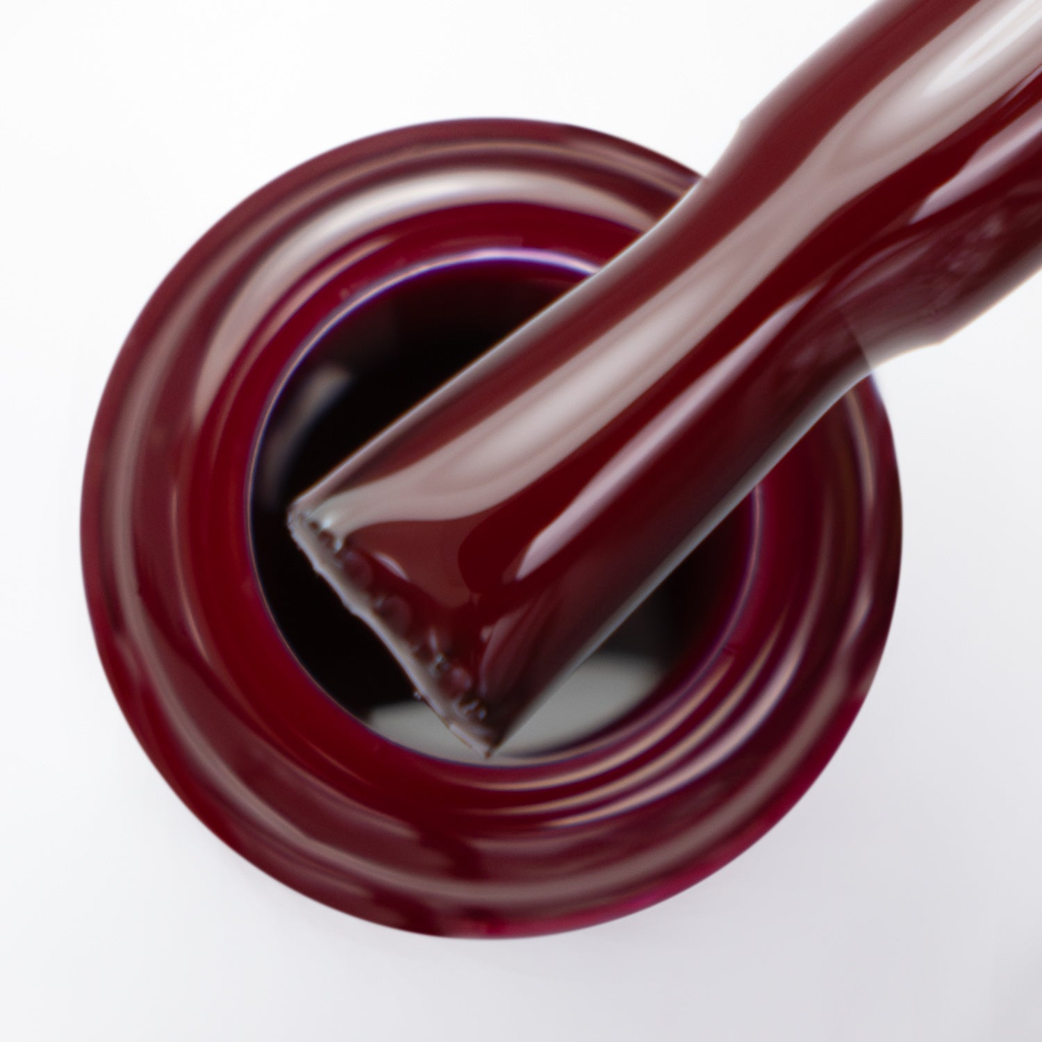 Pincel com o gargalo a mostrar a cor bordô