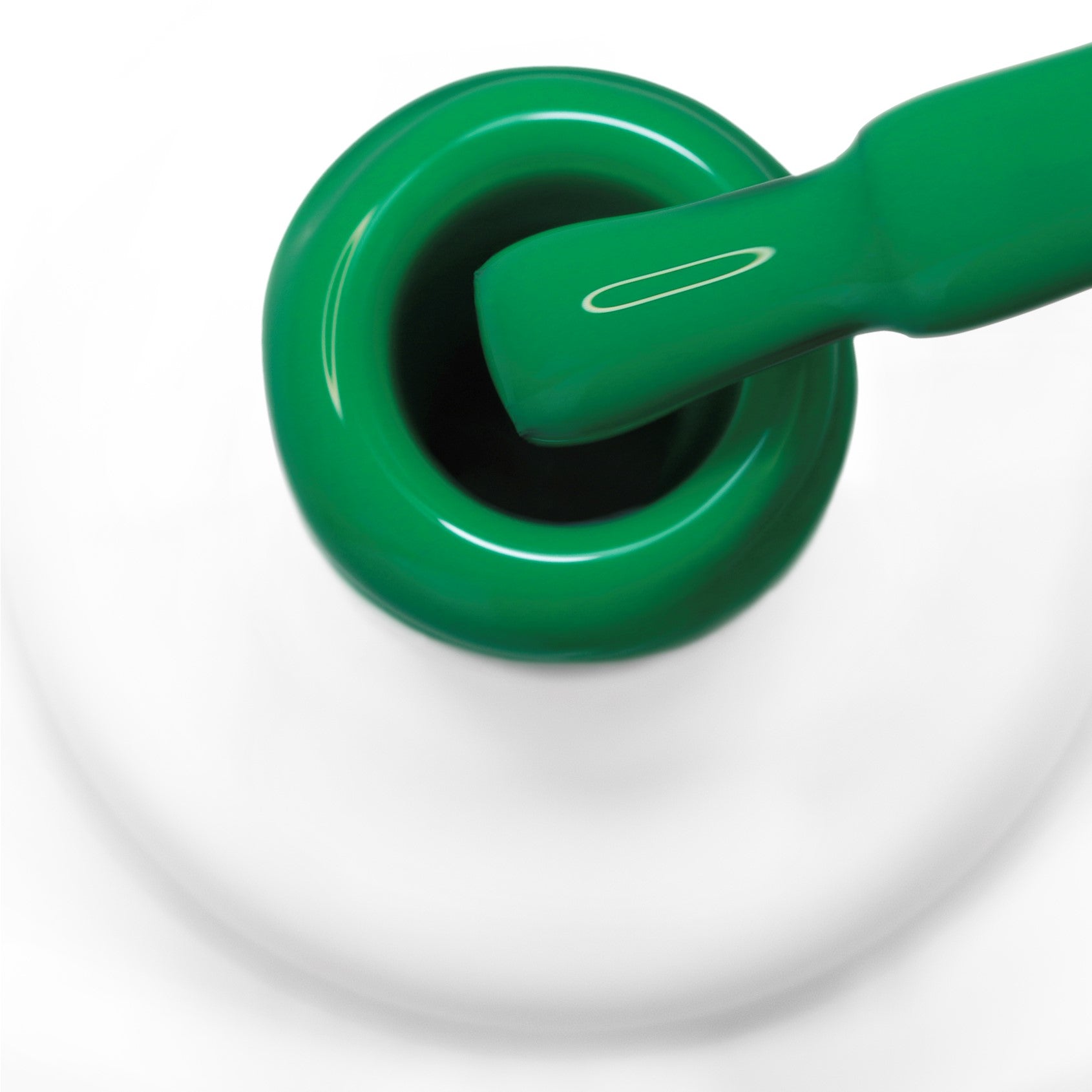 pincel a sair do gargalo a mostrar a cor verde