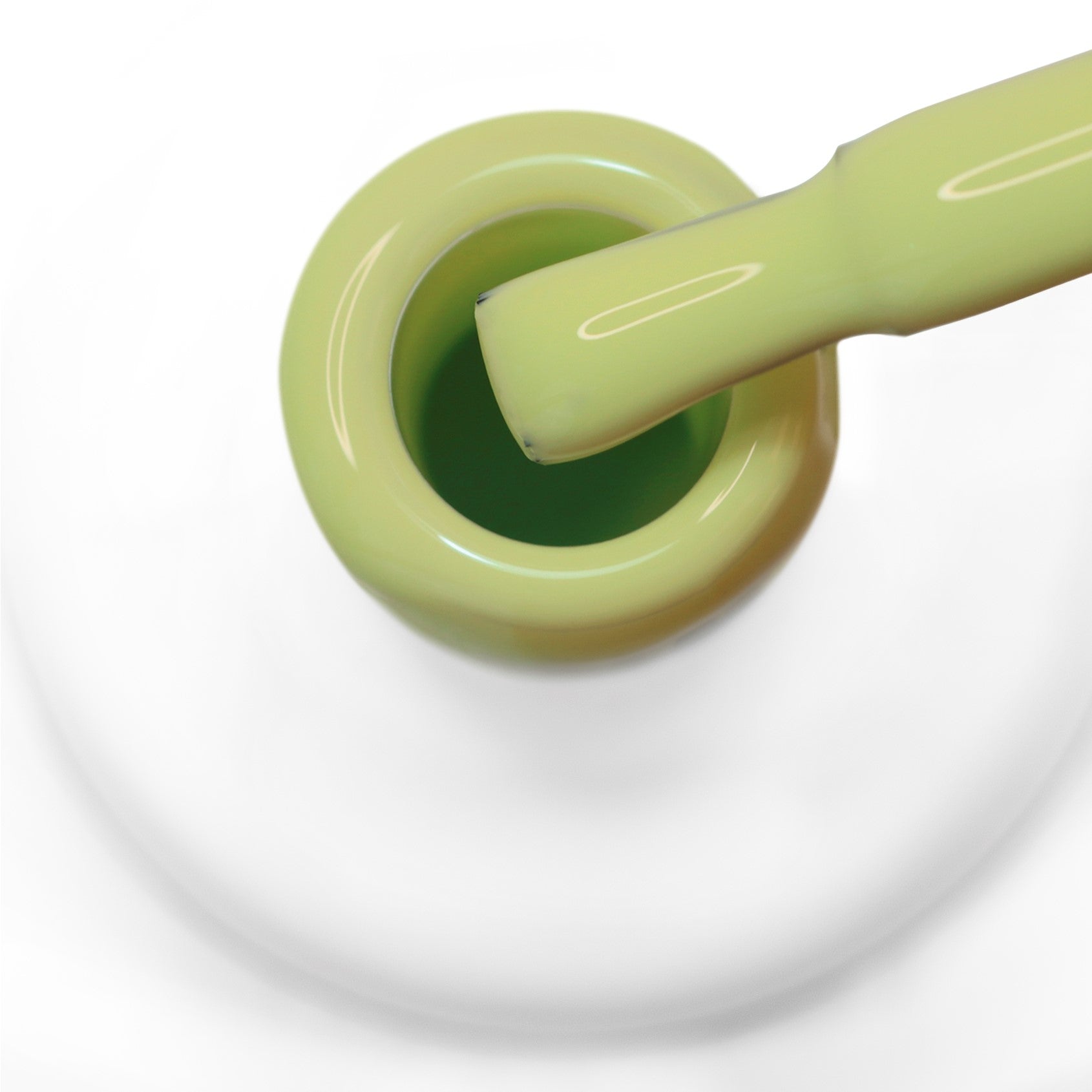 Pincel a sair do gargalo a mostrar a cor verde