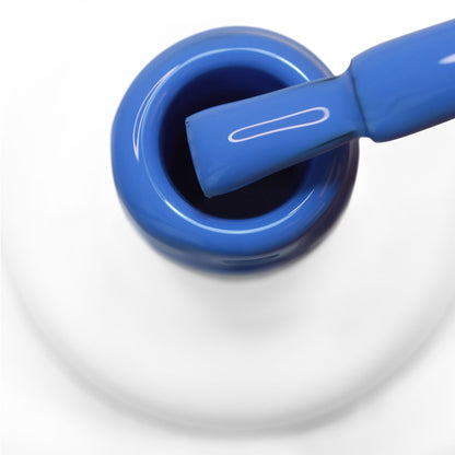 pincel a sair do gargalo a mostrar a cor azul