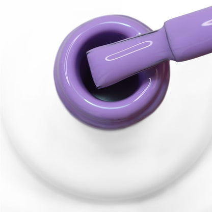 pincel a sair do gargalo a mostrar a cor lilás