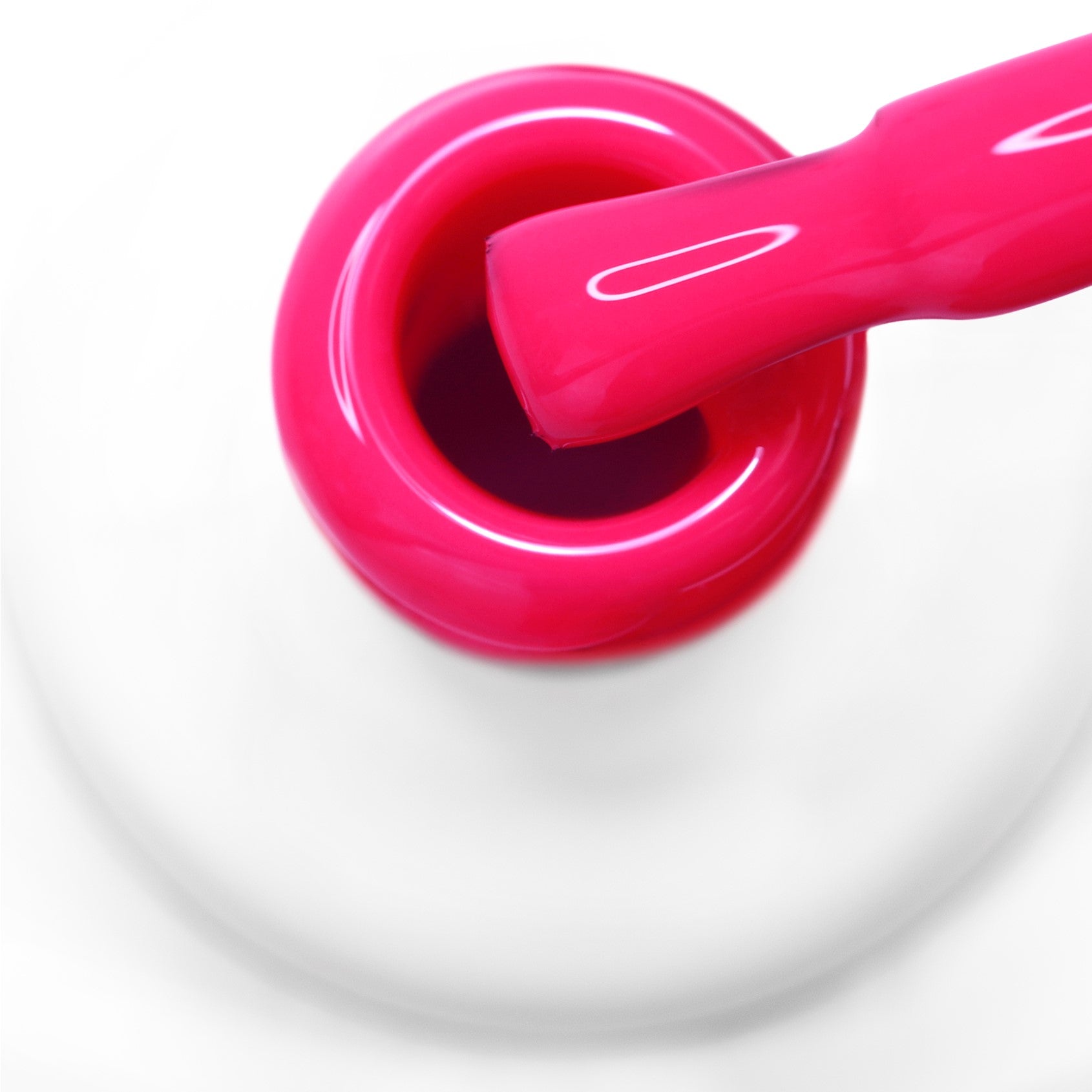 pincel a sair do gargalo a mostrar a cor rosa