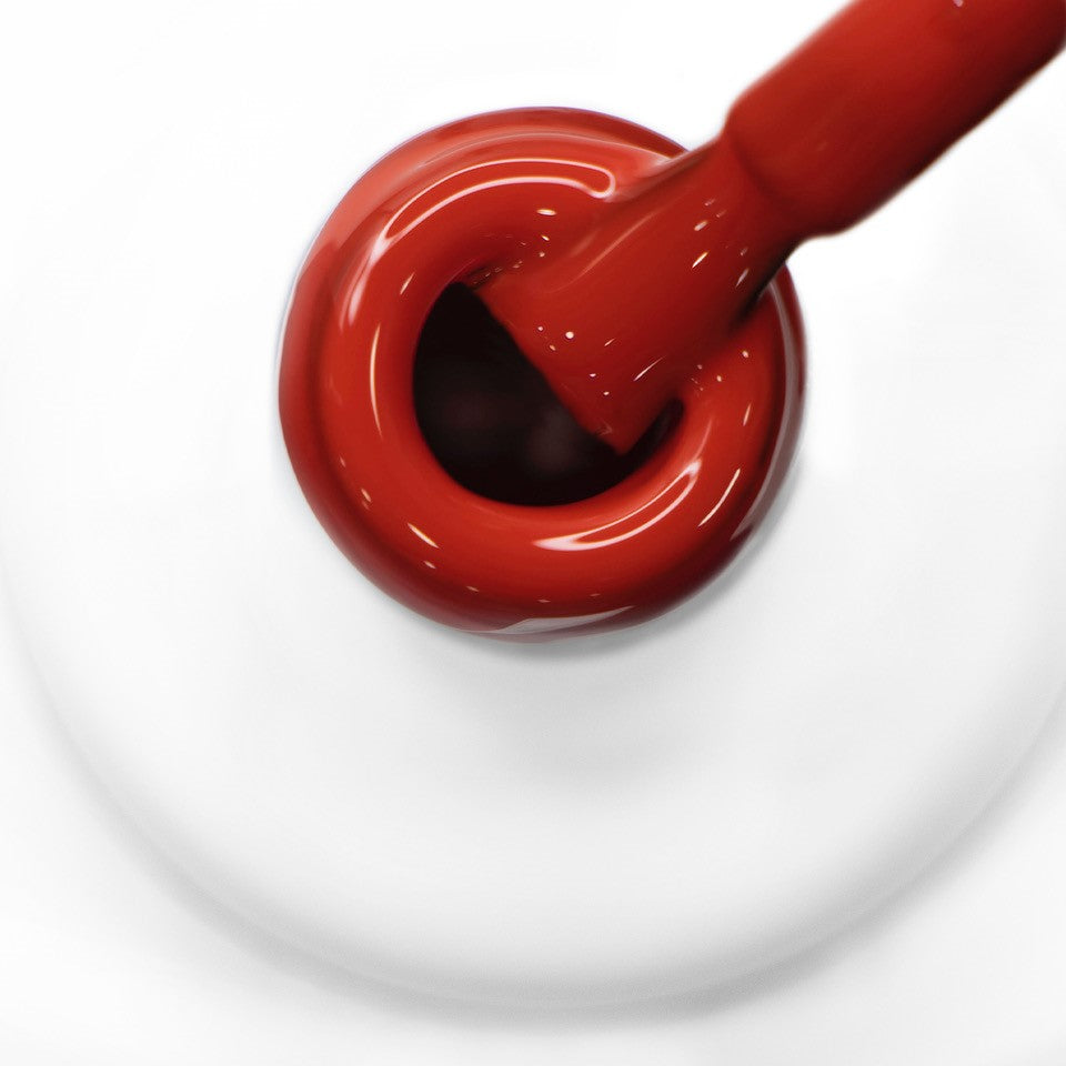 Pincel a sair do gargalo a mostrar a cor